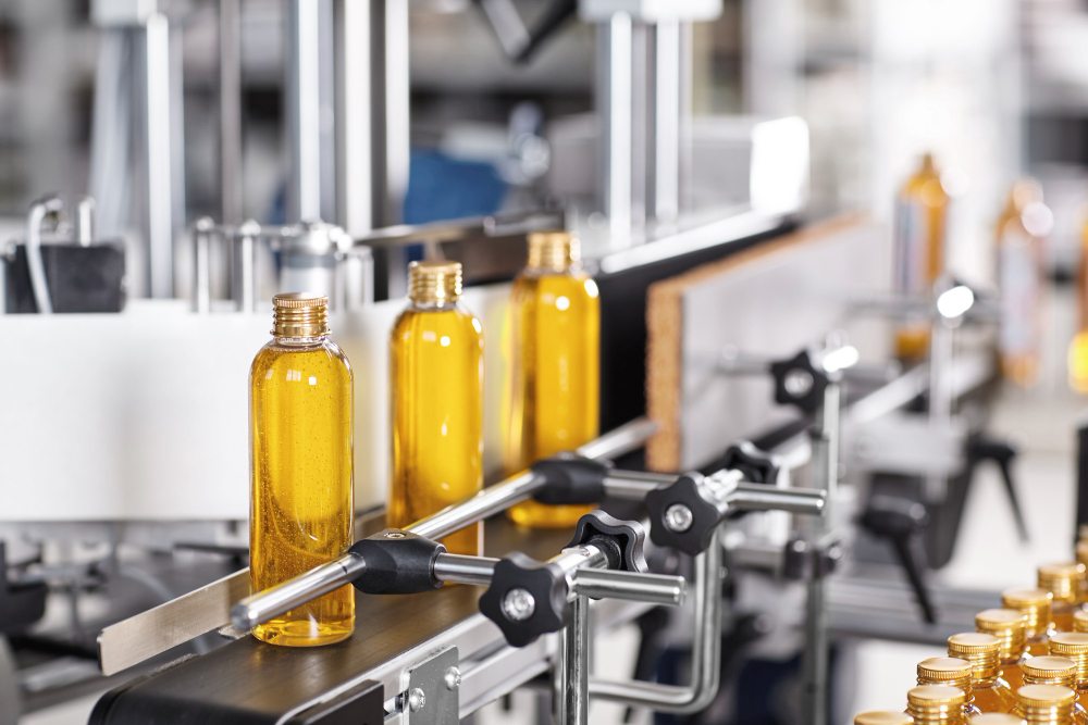 Bottles moving along a factory packaging line