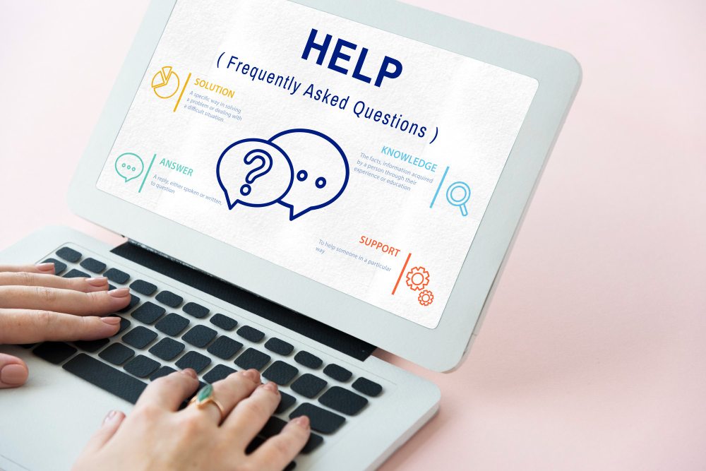 Laptop screen displaying a help and frequently asked questions page